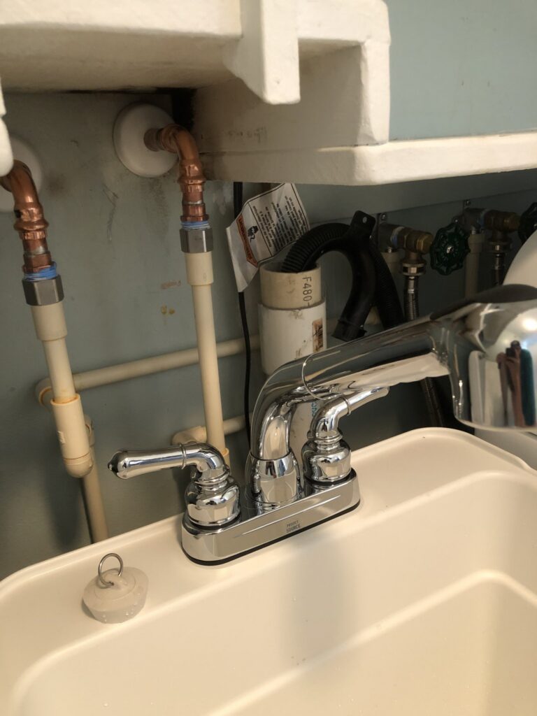 Corroded copper supply lines under a sink near the coast in Palm Coast