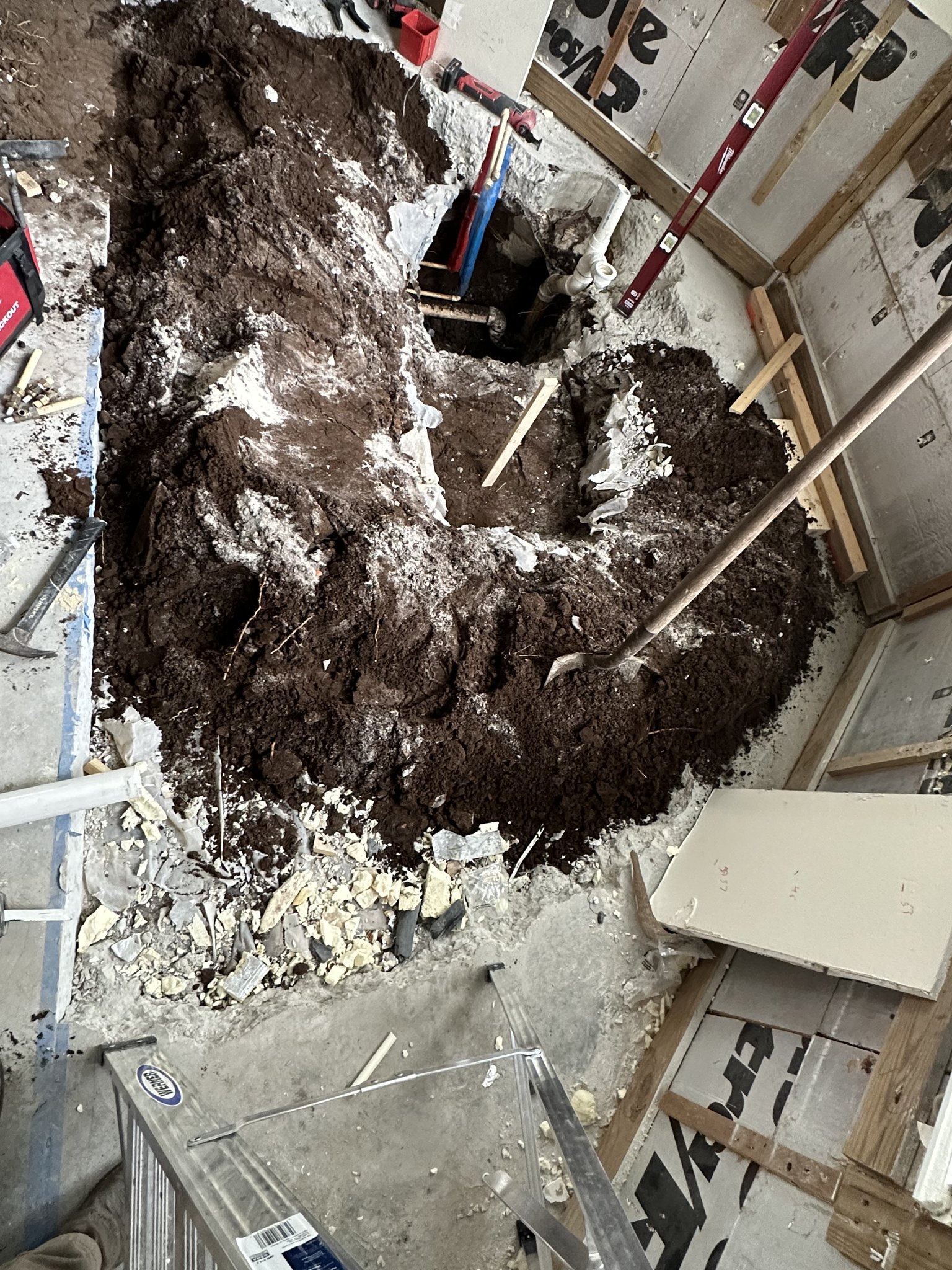 Bathroom remodel with under-slab drain rework, filtration and tiled shower.