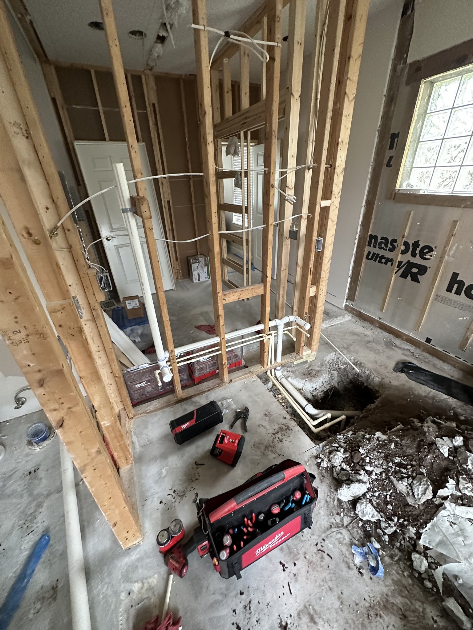 Under-slab drain rework during a Palm Coast bathroom remodel