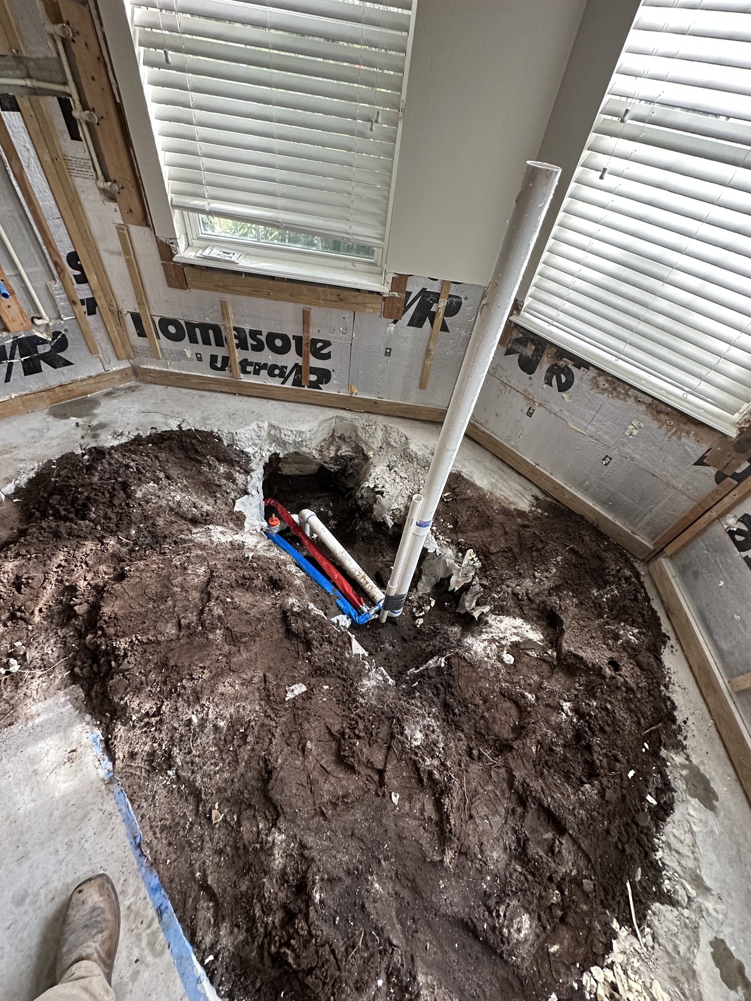 Under-slab drain rework during a Palm Coast bathroom remodel