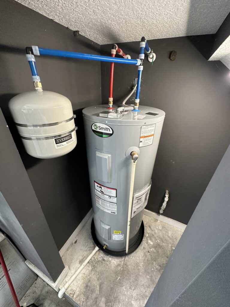 Electric water heater with thermal expansion tank installed in Bunnell