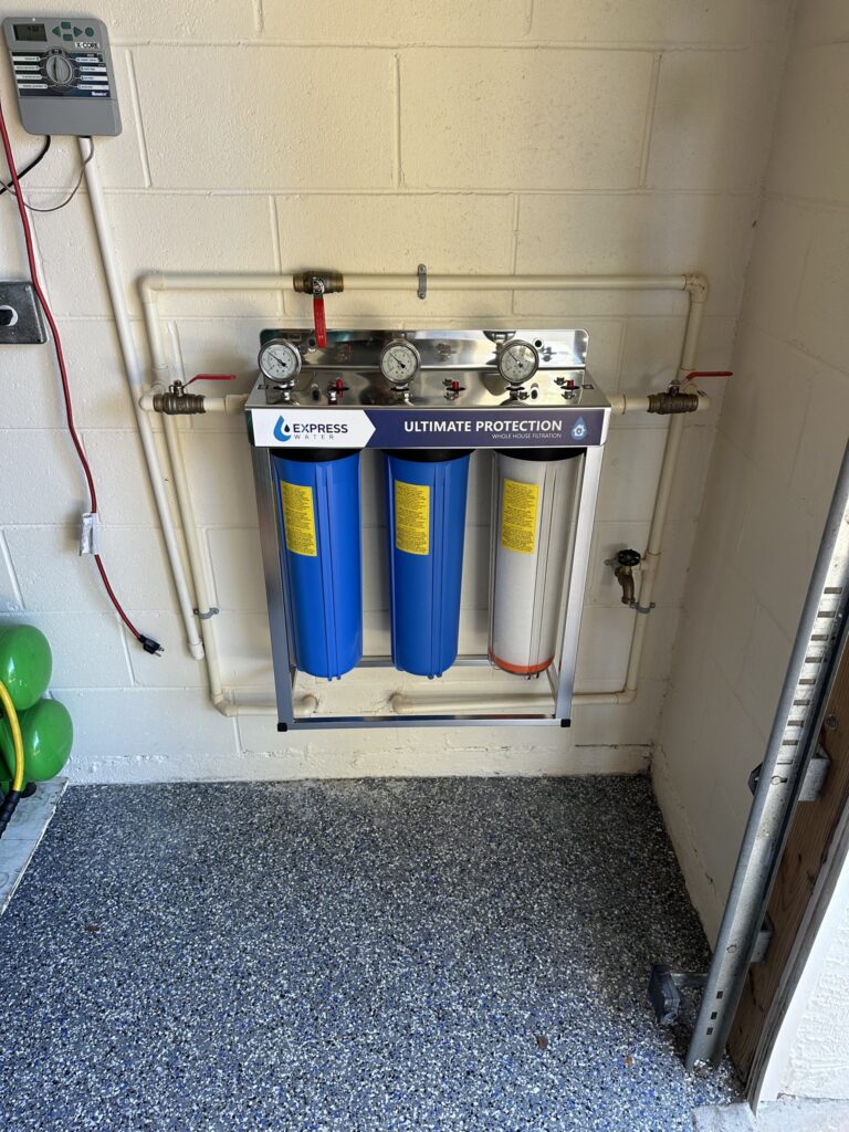 Water filter tanks installed in a utility closet in Flagler County